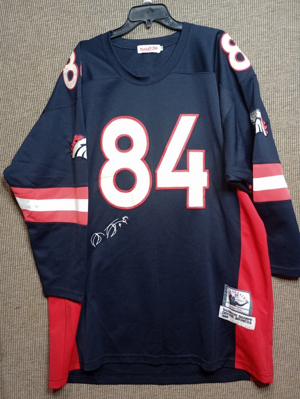 Mitchell & Ness Denver Broncos Jersey #84 Shannon Sharpe jersey with a signature